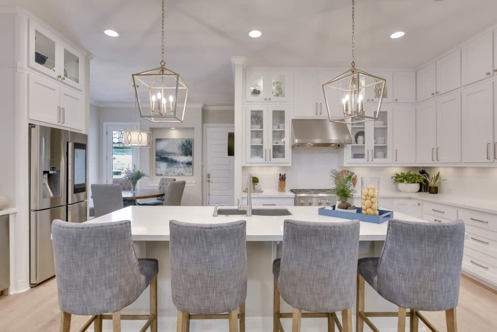 white kitchen with gray stools