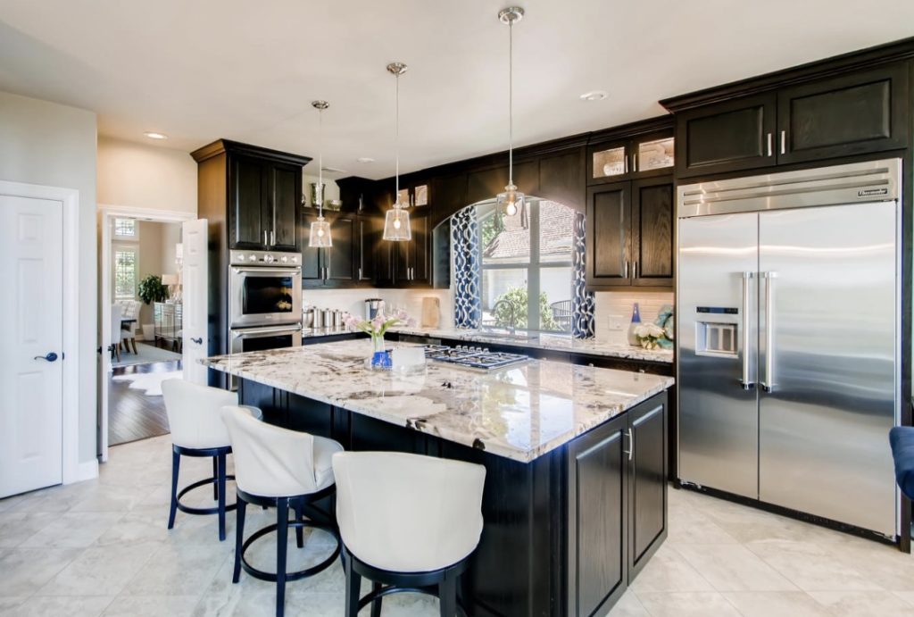 white-granite-countertop-black-cabinets-kitchen