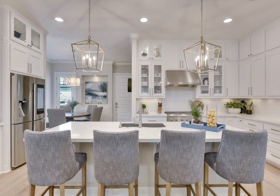 white kitchen with gray stools